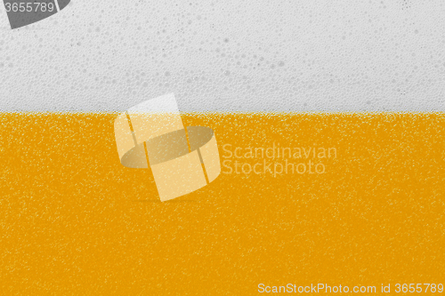 Image of Beer with foam and bubbles