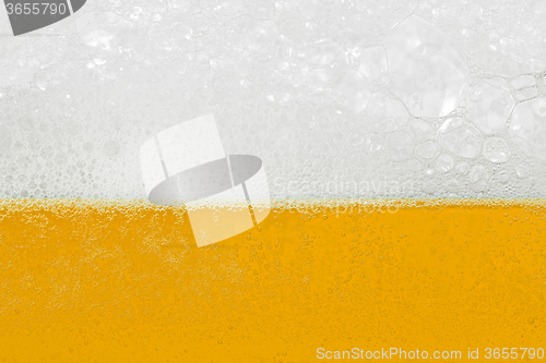 Image of Beer with foam and bubbles
