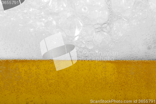 Image of Beer with foam and bubbles