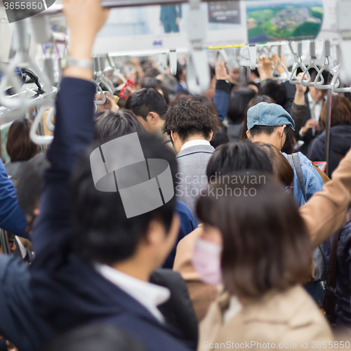 Image of Passengers traveling by Tokyo metro.