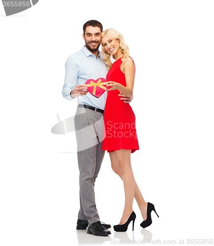 Image of happy couple with red heart shaped gift box