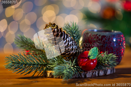 Image of christmas fir branch decoration and candle lantern