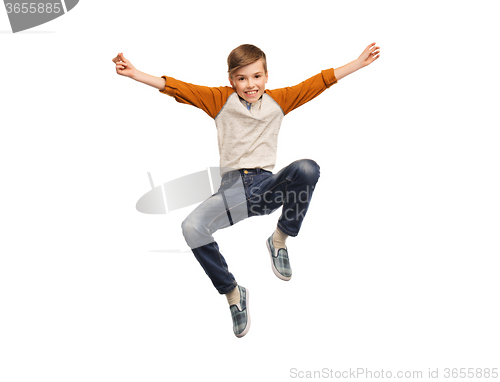 Image of happy smiling boy jumping in air