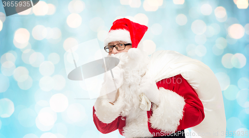 Image of man in costume of santa claus with bag