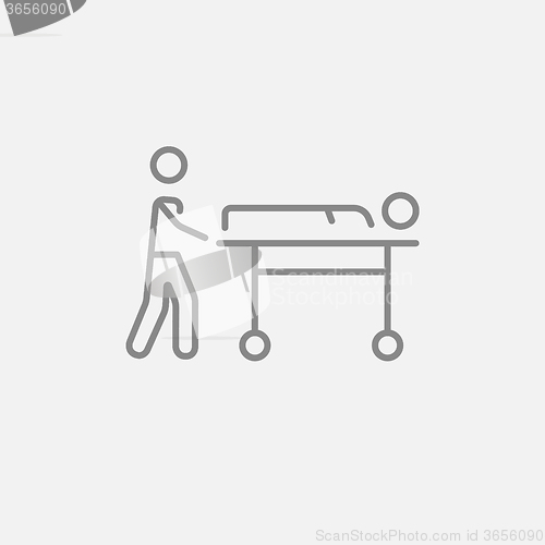 Image of Man pushing stretchers line icon.
