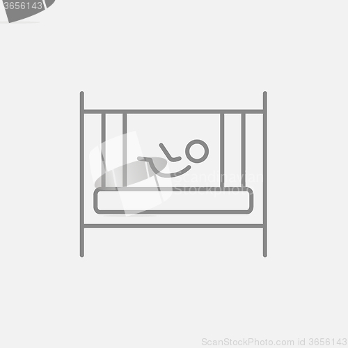 Image of Baby laying in crib line icon.