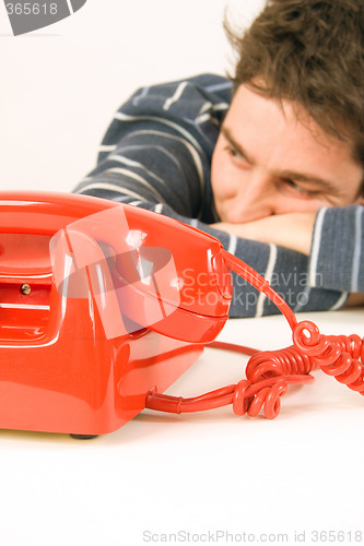 Image of man waiting for a call