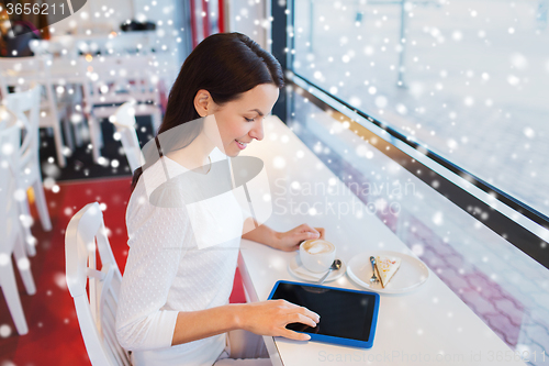 Image of smiling woman with tablet pc and coffee at cafe