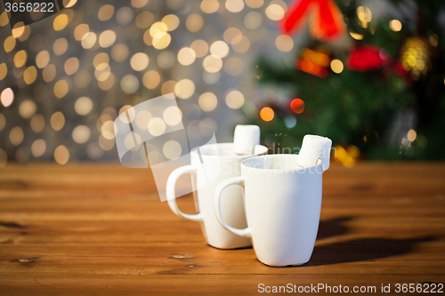 Image of cups of hot chocolate with marshmallow on wood