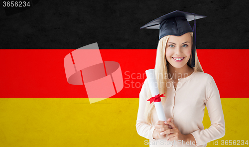 Image of happy student girl in bachelor cap with diploma