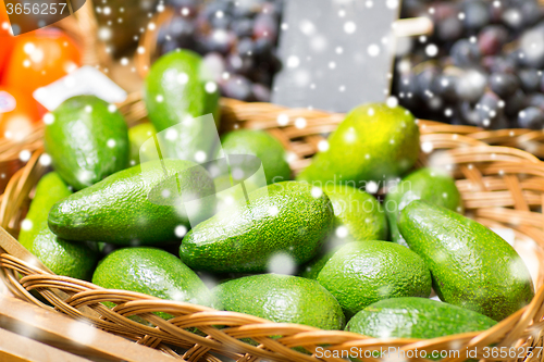 Image of avocado in basket at food market