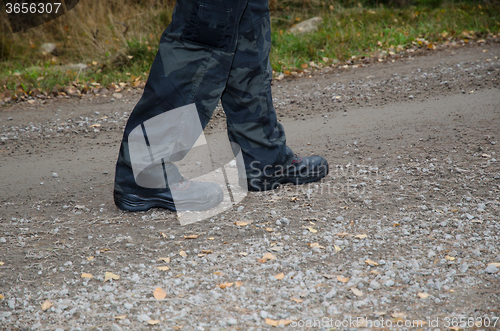Image of Walking on a gravel road