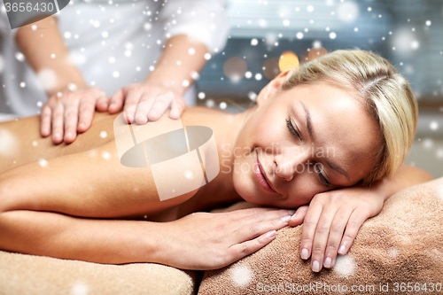 Image of close up of woman having back massage in spa