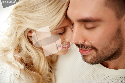 Image of close up of happy couple faces with closed eyes
