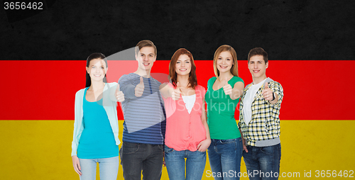 Image of group of smiling students showing thumbs up