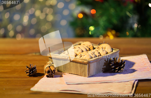 Image of close up of christmas oat cookies on wooden table