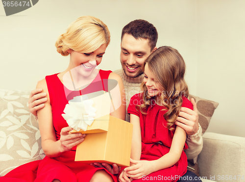 Image of happy family opening gift box