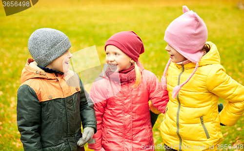 Image of group of happy children in autumn park