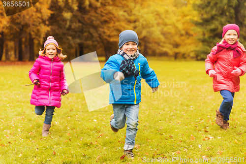 Image of group of happy little kids running outdoors