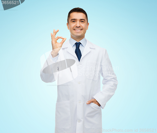 Image of smiling doctor in white coat showing ok hand sign