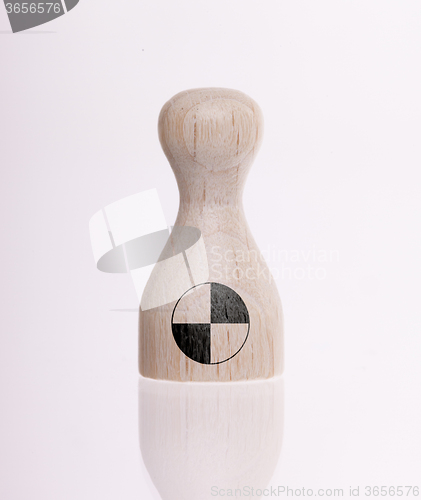 Image of Wooden pawn with a painting of a flag