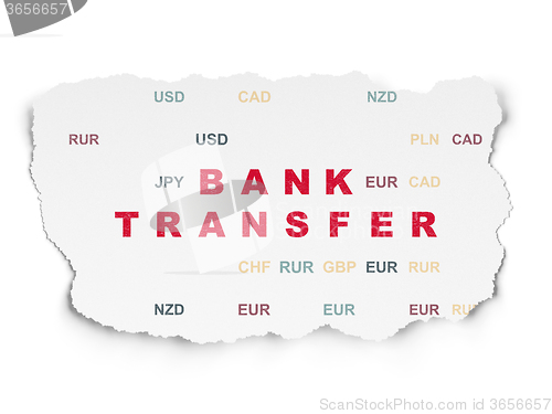 Image of Currency concept: Bank Transfer on Torn Paper background