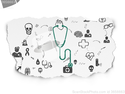 Image of Health concept: Stethoscope on Torn Paper background