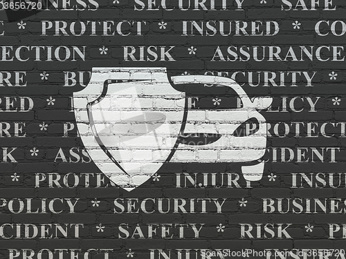 Image of Insurance concept: Car And Shield on wall background