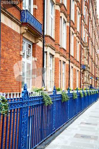 Image of old window in europe  red brick wall     and      historical 