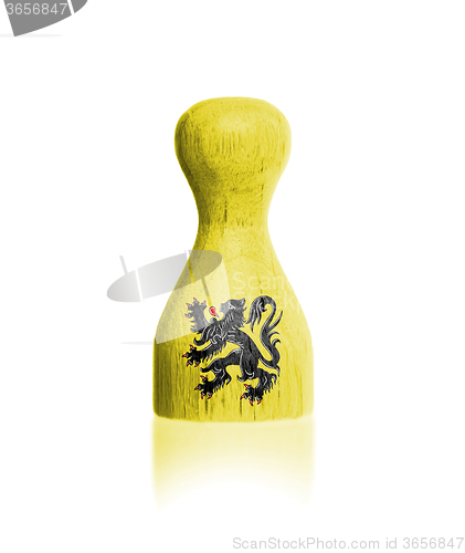 Image of Wooden pawn with a painting of a flag