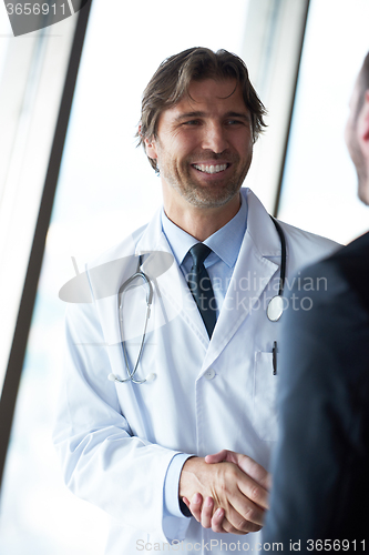 Image of doctor handshake with a patient