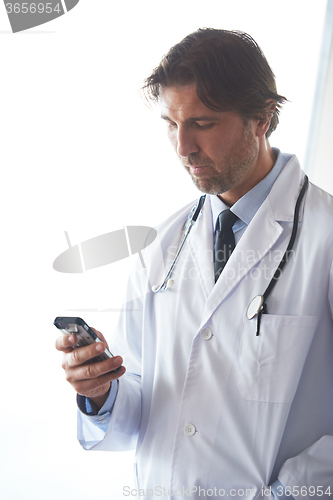 Image of doctor speaking on cellphone