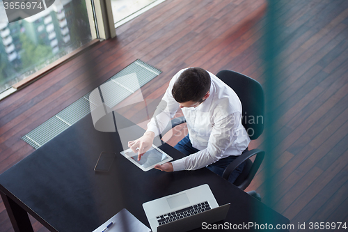 Image of top view of young business man at office