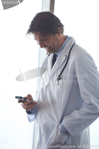 Image of doctor speaking on cellphone