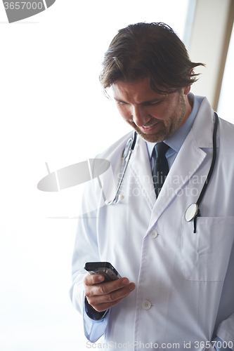 Image of doctor speaking on cellphone