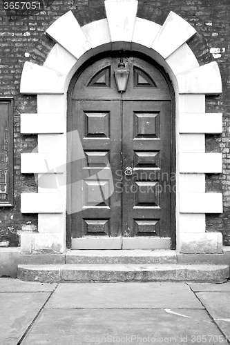 Image of wooden parliament in london old church door and marble antique  