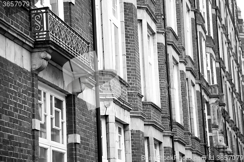 Image of old window in europe london  red brick wall and      historical 