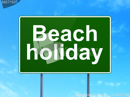 Image of Travel concept: Beach Holiday on road sign background
