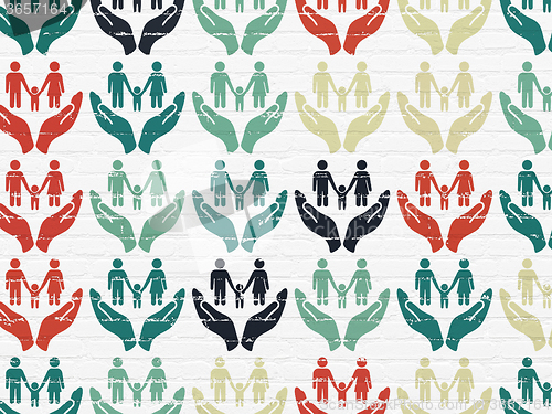 Image of Insurance concept: Family And Palm icons on wall background