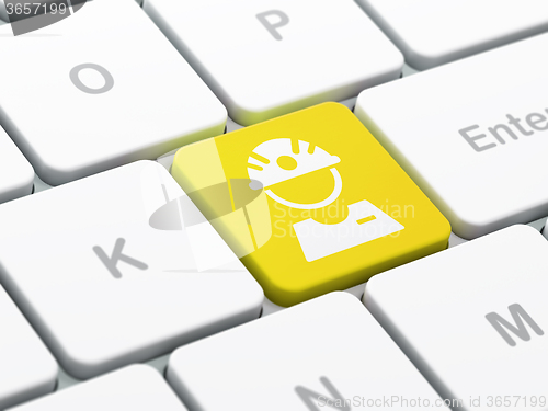 Image of Industry concept: Factory Worker on computer keyboard background