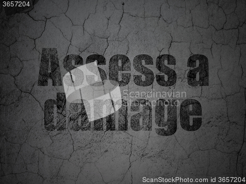 Image of Insurance concept: Assess A Damage on grunge wall background