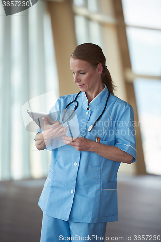 Image of female doctor with tablet computer