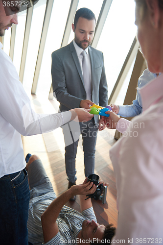 Image of business people group assembling jigsaw puzzle