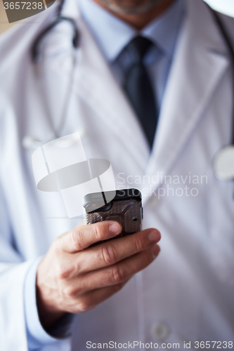 Image of doctor speaking on cellphone