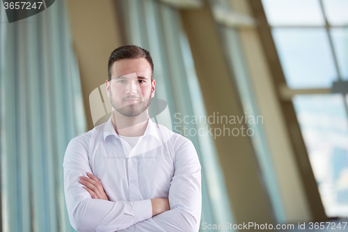 Image of business man with beard at modern office