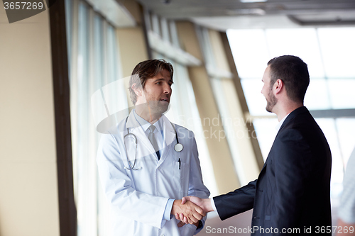 Image of doctor handshake with a patient