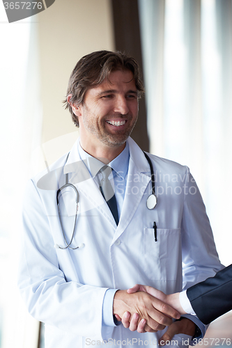 Image of doctor handshake with a patient