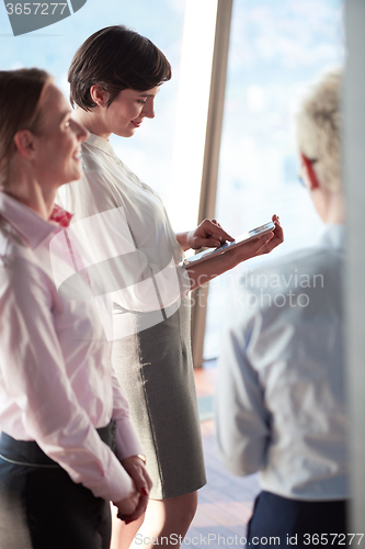 Image of business woman working on tablet computer