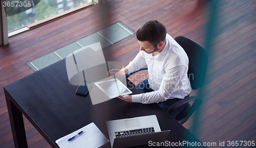 Image of top view of young business man at office