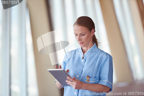 Image of female doctor with tablet computer